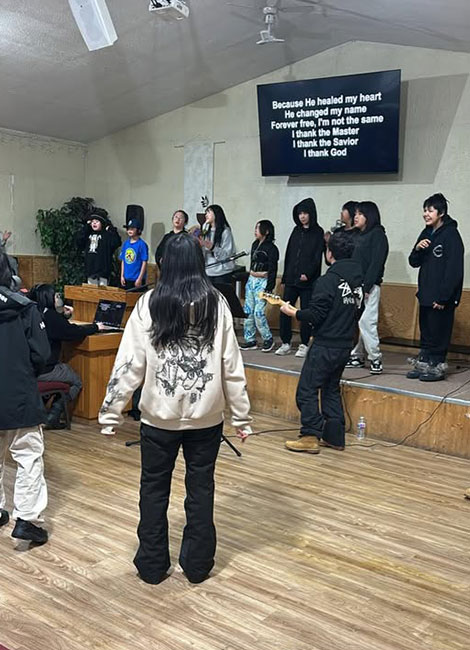 Tlicho Christian Fellowship youth worship team leading a church service indoors